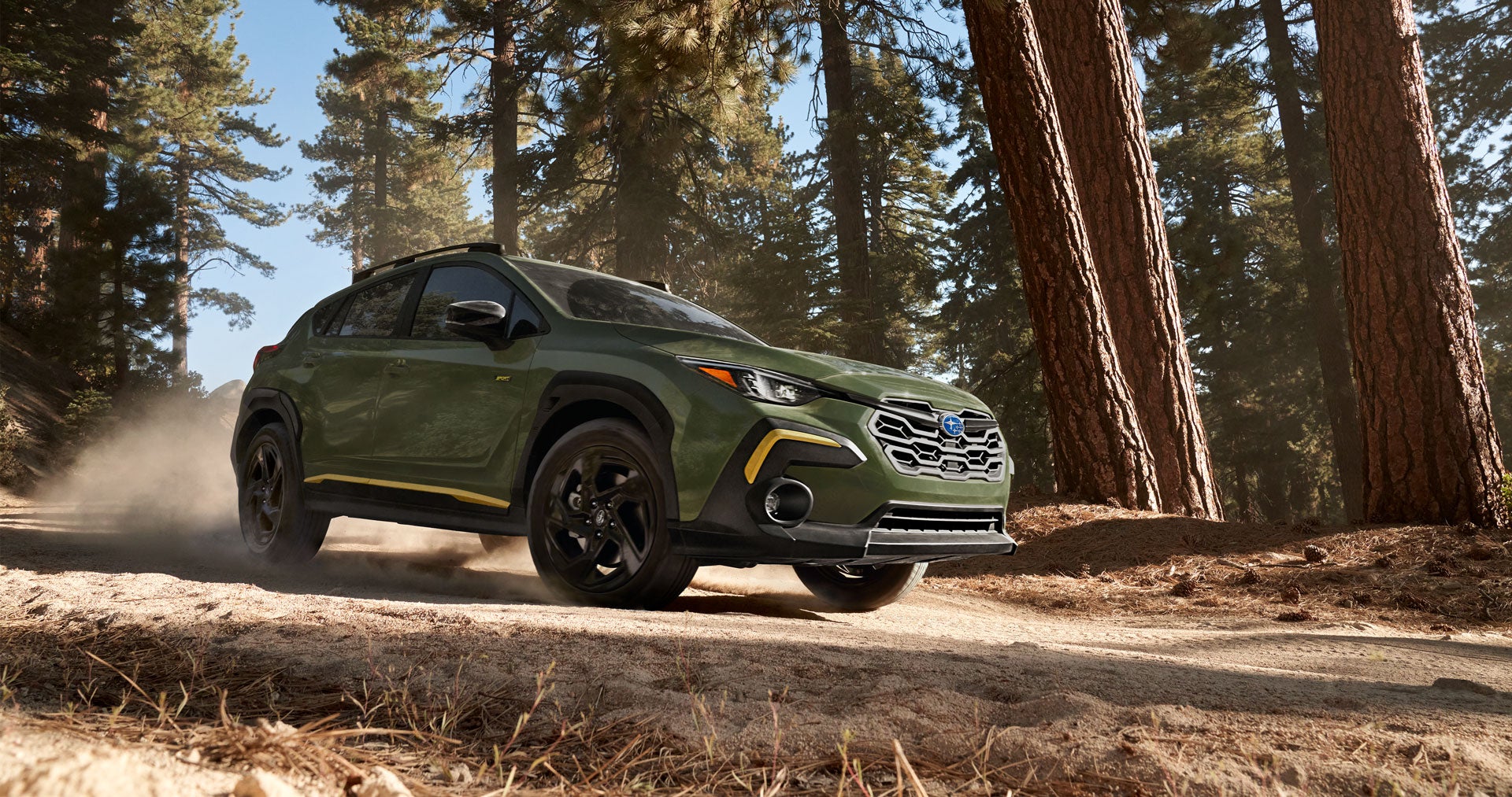 Green Subaru Crosstrek driving off-road 