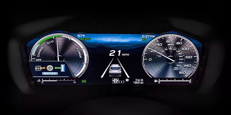 A digital car dashboard showing 21 mph, ECO/Charge/Power gauges, a speedometer, and a simulated car on a road.