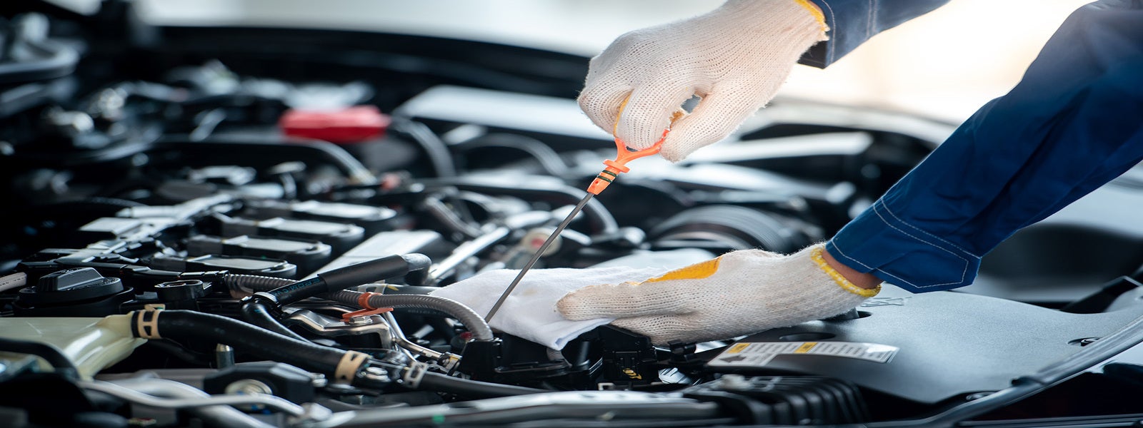 Service technician performing oil change